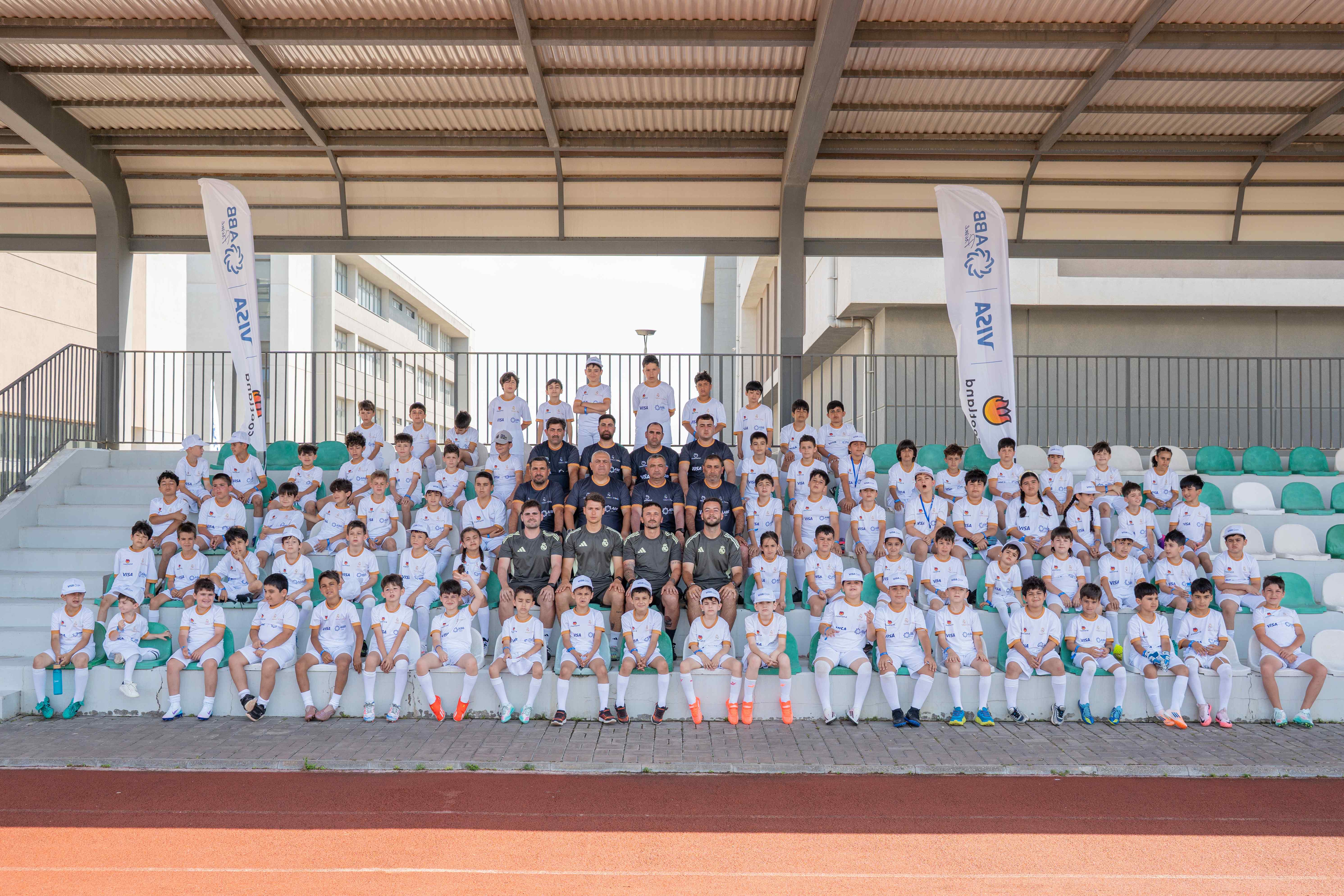 Real Madrid Foundation team with coaches and players at clinic