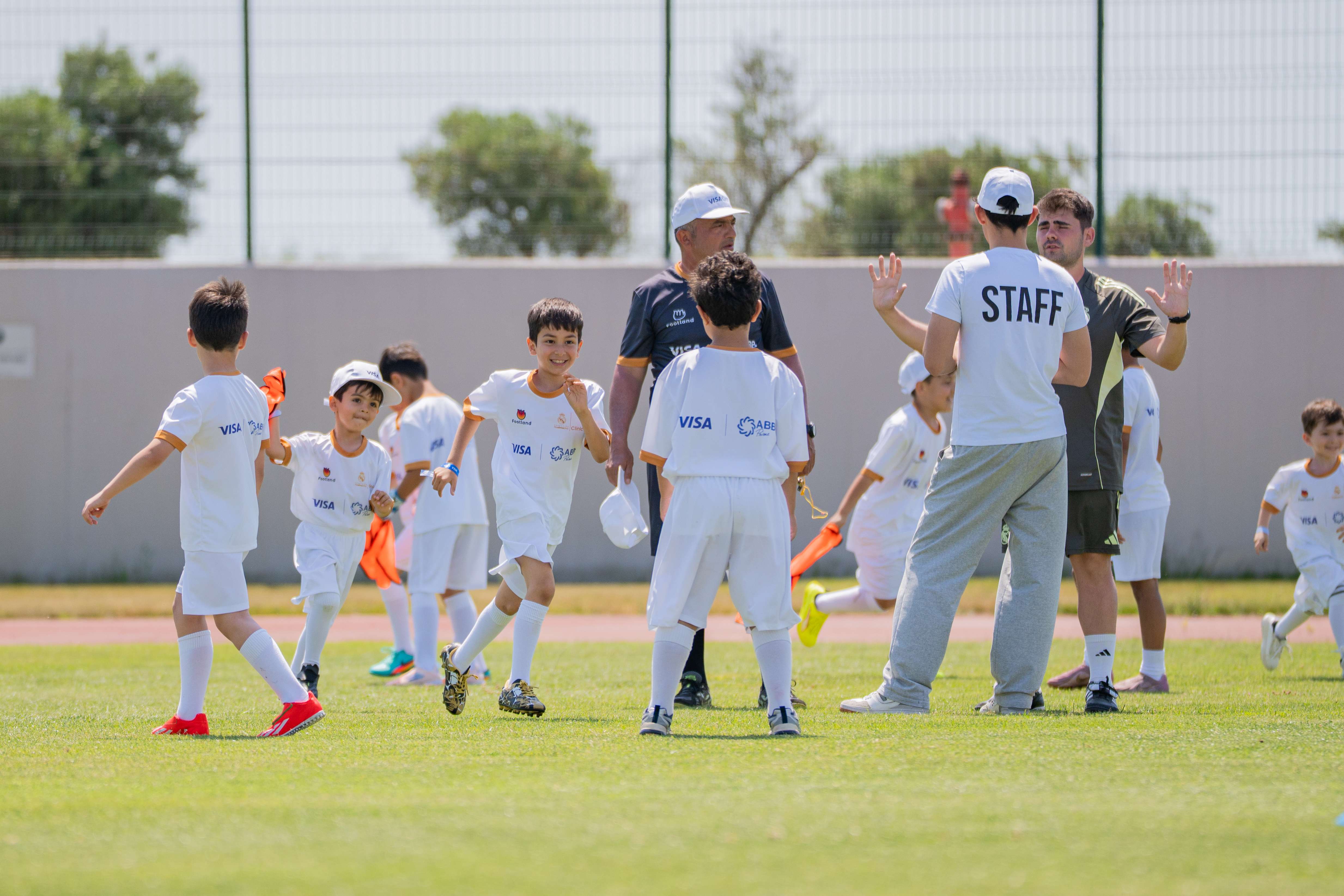 Young players learning football technique with Real Madrid Foundation coaches
